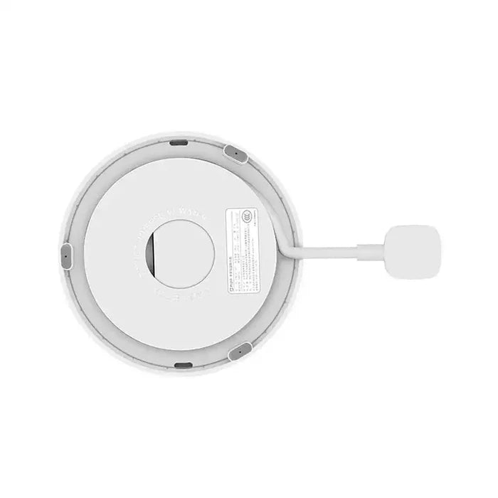The back of a white light with a white button