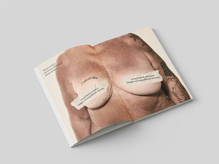 The Chests book open to a full-width portrait of a bare chest with printed captions placed over the nipples