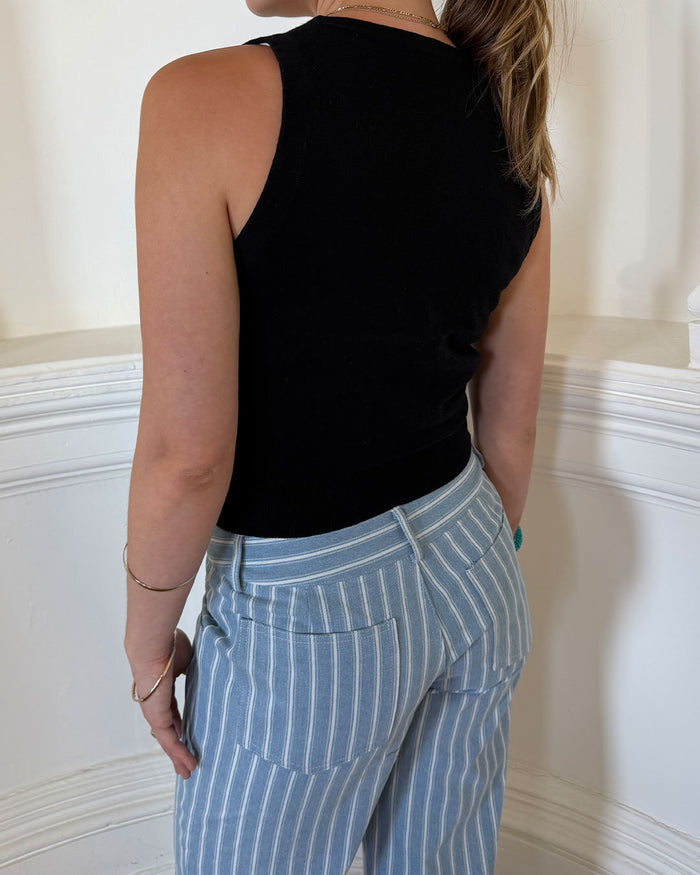 Women's black knit sleeveless top with scoop neck and cinched ribbed waist band