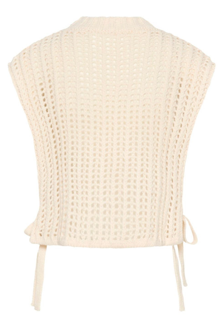 Lightweight open knit slipover in whisper white by Cream. Easy to layer with shirts or dresses for relaxed everyday style. Shop at Dotique.