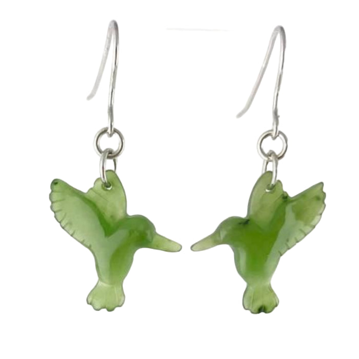 Green jade bird-shaped earrings on silver hooks against a white background
