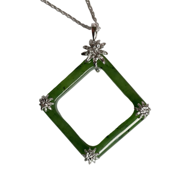 Green jade square pendant with silver chain on a white background