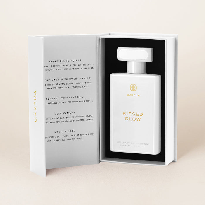 Kissed Glow Extrait de Parfum bottle in its open gift box