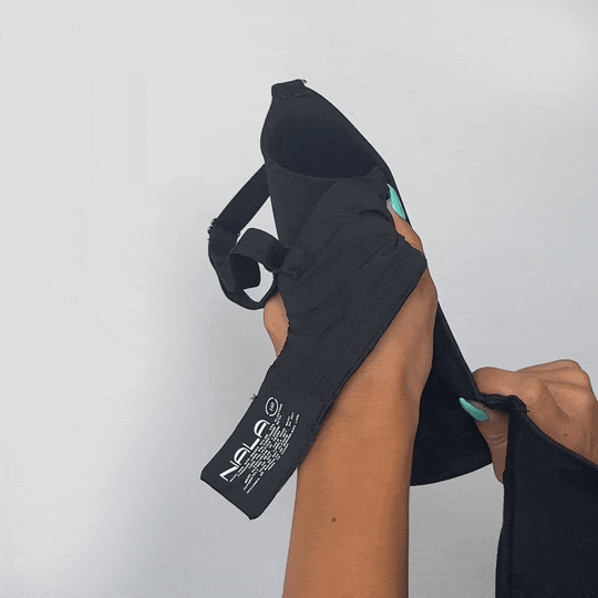 Hands stretching the fabric of the Padded Flexiwire Bra in black to show the give in the material