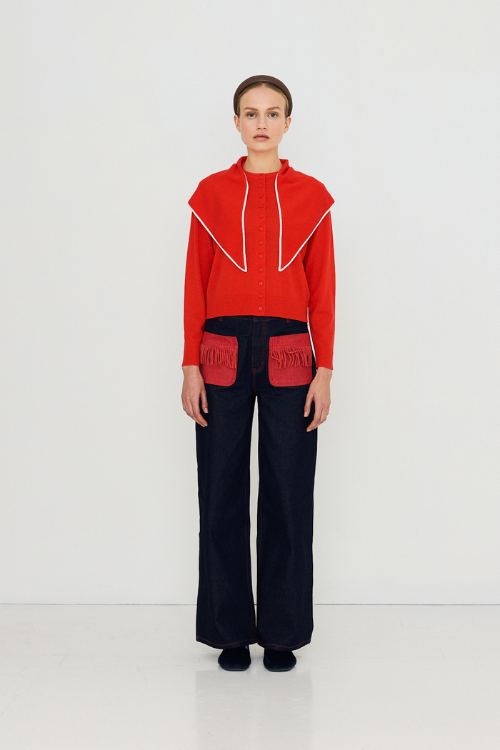 Shop The Tiny Big Sister wide-leg denim trousers in indigo with contrast red fringed pockets. 100% Cotton statement denim at Dotique.
