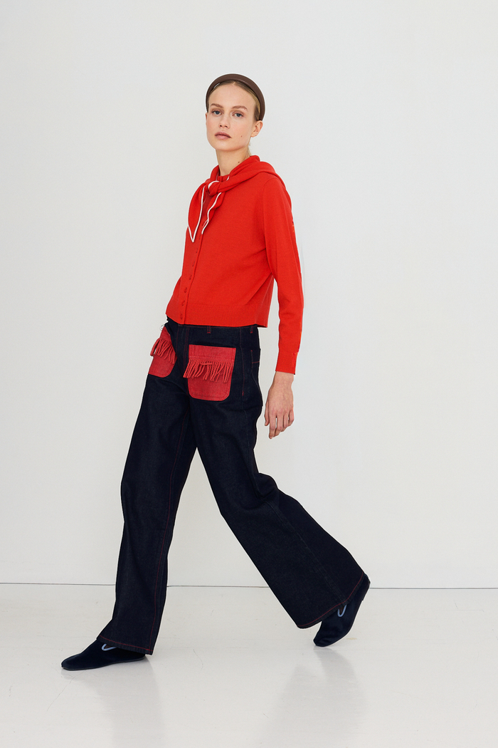 Shop The Tiny Big Sister wide-leg denim trousers in indigo with contrast red fringed pockets. 100% Cotton statement denim at Dotique.