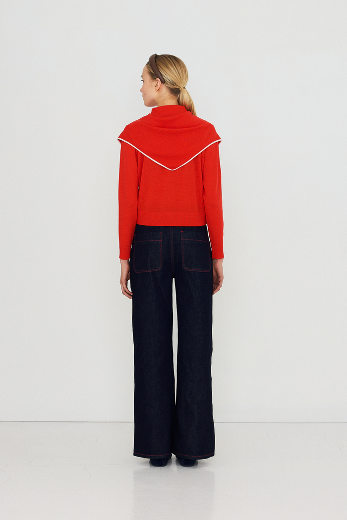 Shop The Tiny Big Sister wide-leg denim trousers in indigo with contrast red fringed pockets. 100% Cotton statement denim at Dotique.