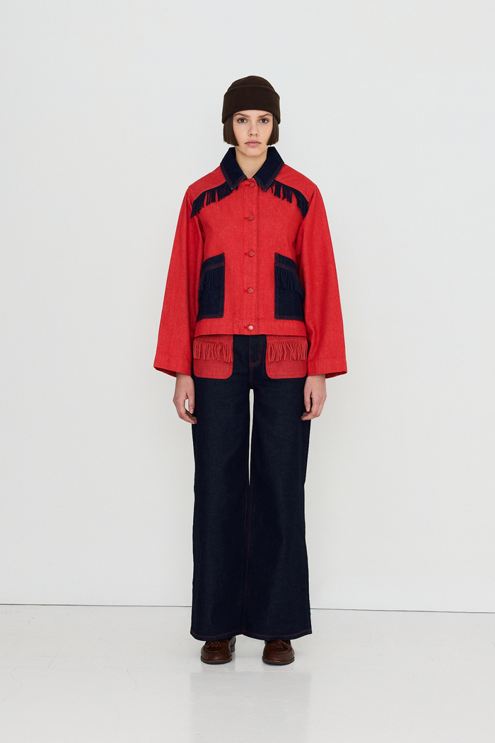 Shop The Tiny Big Sister wide-leg denim trousers in indigo with contrast red fringed pockets. 100% Cotton statement denim at Dotique.