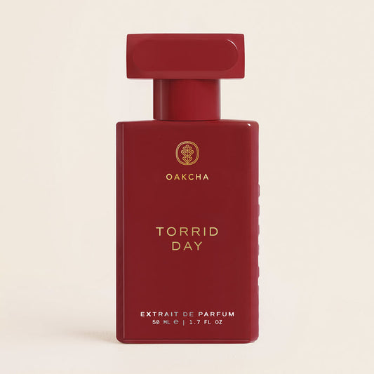 Front view of red Torrid Day Extrait de Parfum bottle showing 50 mL 1.7 fl oz label on cream background