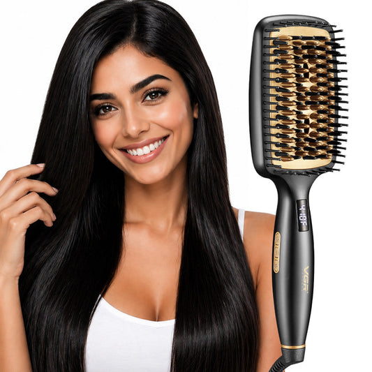 A smiling woman with long, straight, glossy black hair holds up a black Vgr flat styling brush with gold-colored bristles and a beige bristle cap, set against a solid white background.