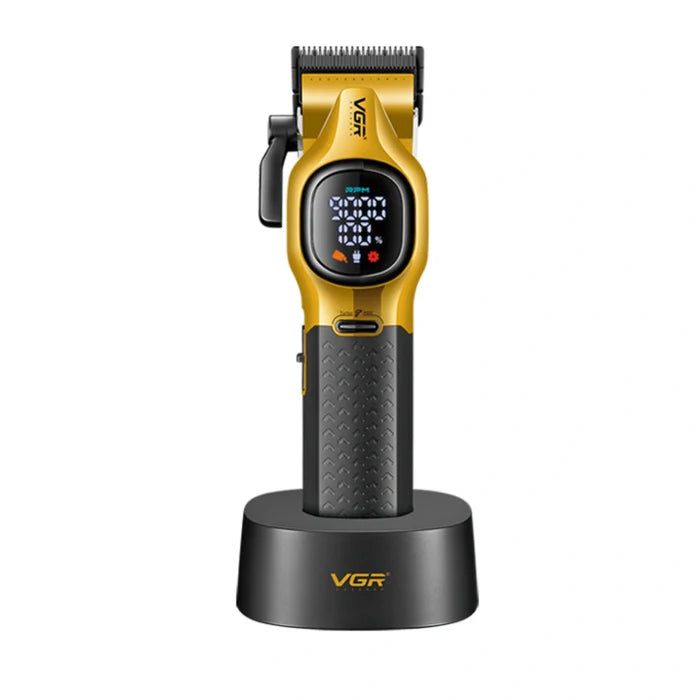 Gold and black hair clipper with digital display on a white background